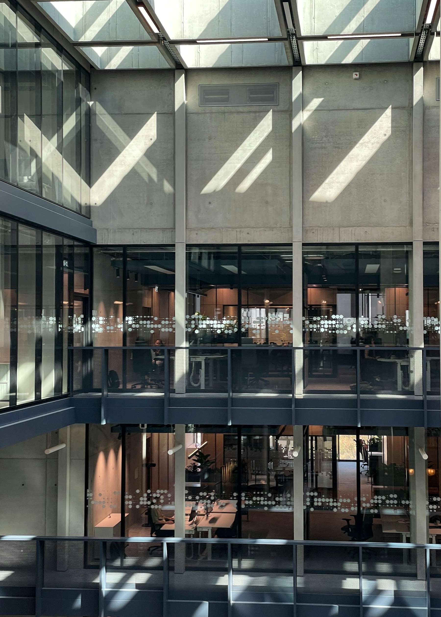 Glass and stone architecture within a spacious commercial atrium